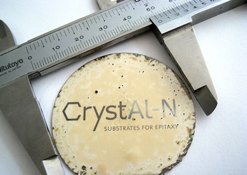 AlN wafer and logo of the company CrystAl-N GmbH
